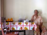 Aunt Sumpha sampling a batch of Orville Redenbacher's best popped goods - Home, Phnom Penh